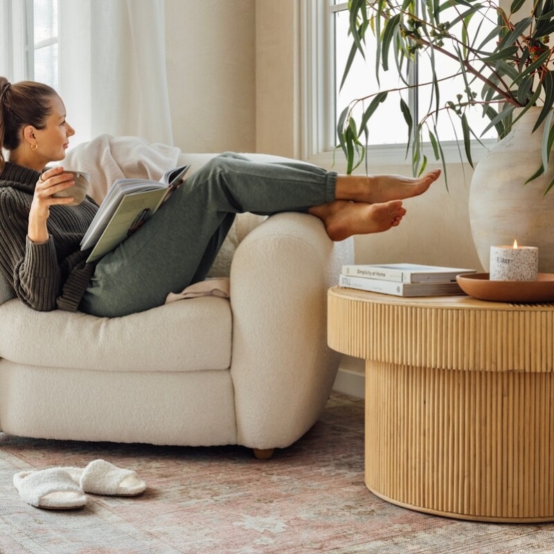 Camille Styles wearing loungewear sitting in armchair_stress and gut health