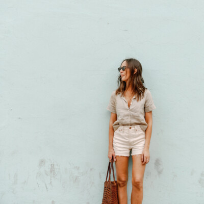 Camille Styles wearing white denim shorts.