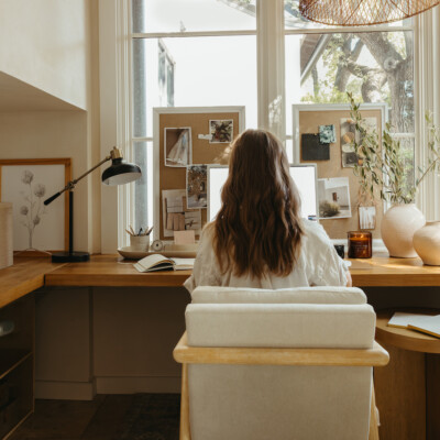 Camille Styles working at desk.