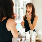 Catt Sadler applying lip treatment