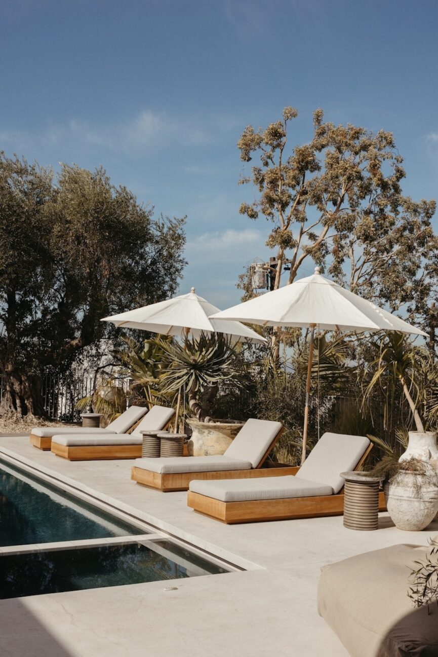 Chaise lounges by pool.