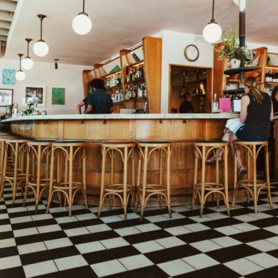 Woman sits at a countertop at Junes All Day in Austin, Texas. Part of our Guide to the Best Brunch in Austin.