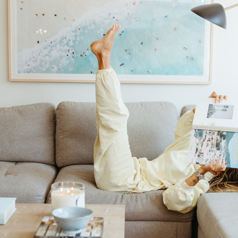 Woman reading on couch.