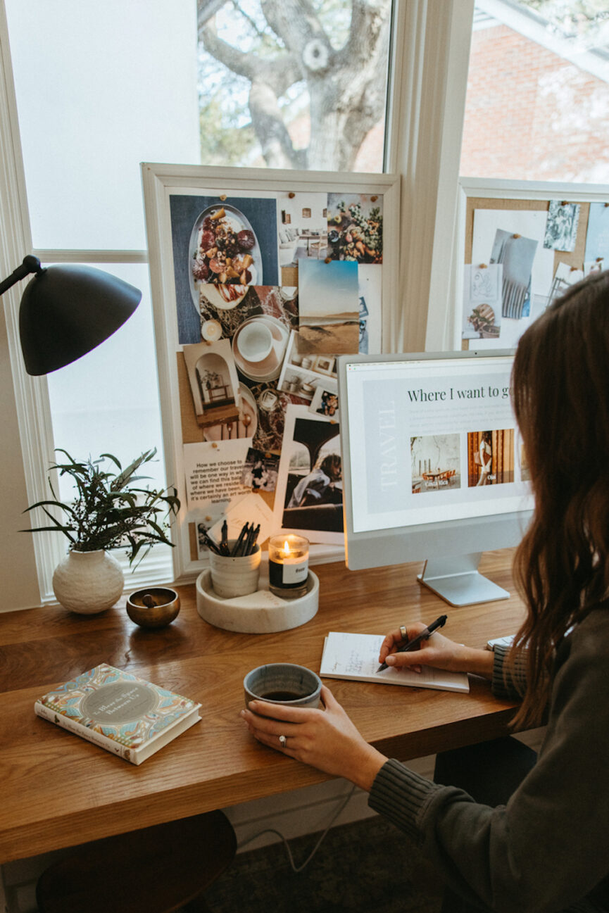 Woman writing at desk.