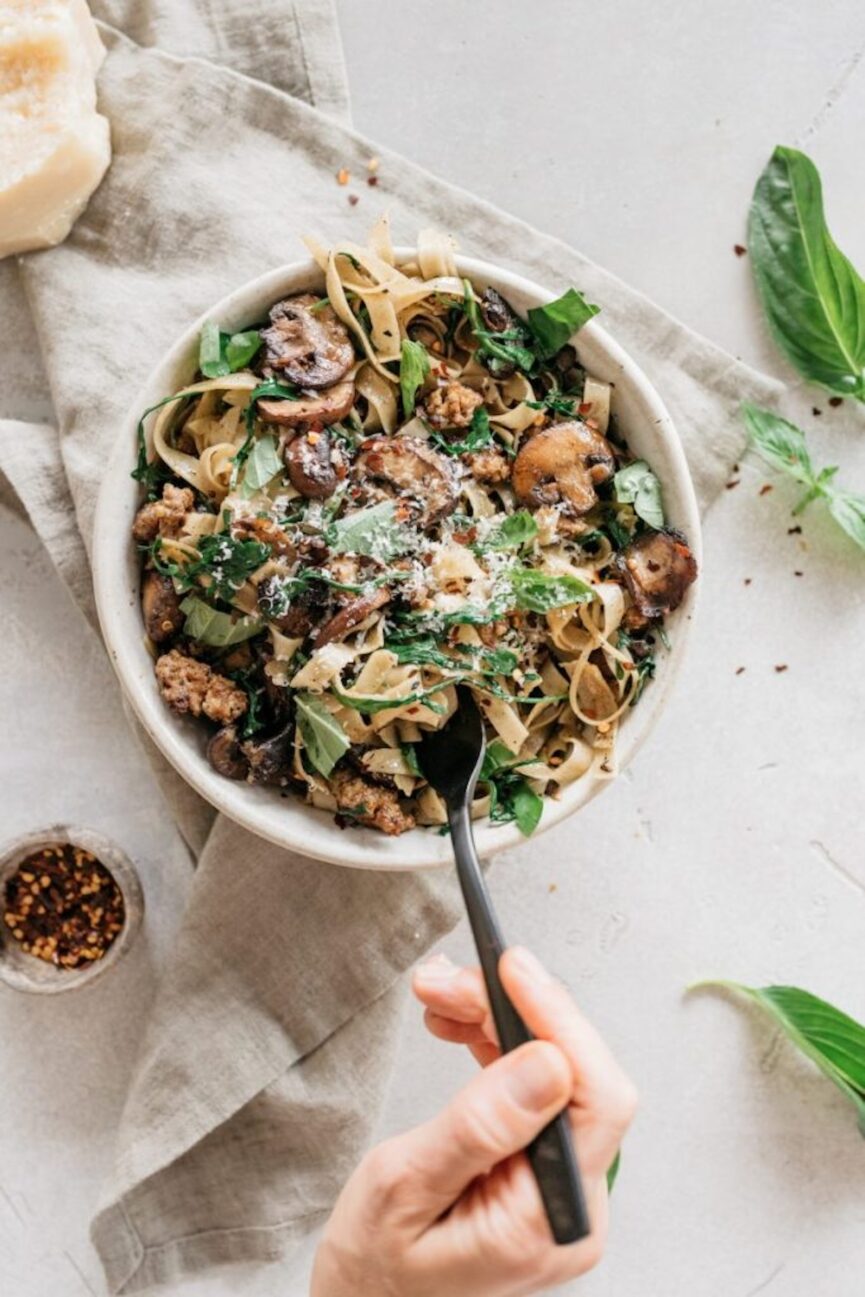 one pot garlicky mushroom pasta with sausage and arugula