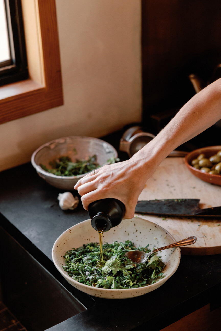 pouring olive oil into Italian salsa verde_foods for brain health