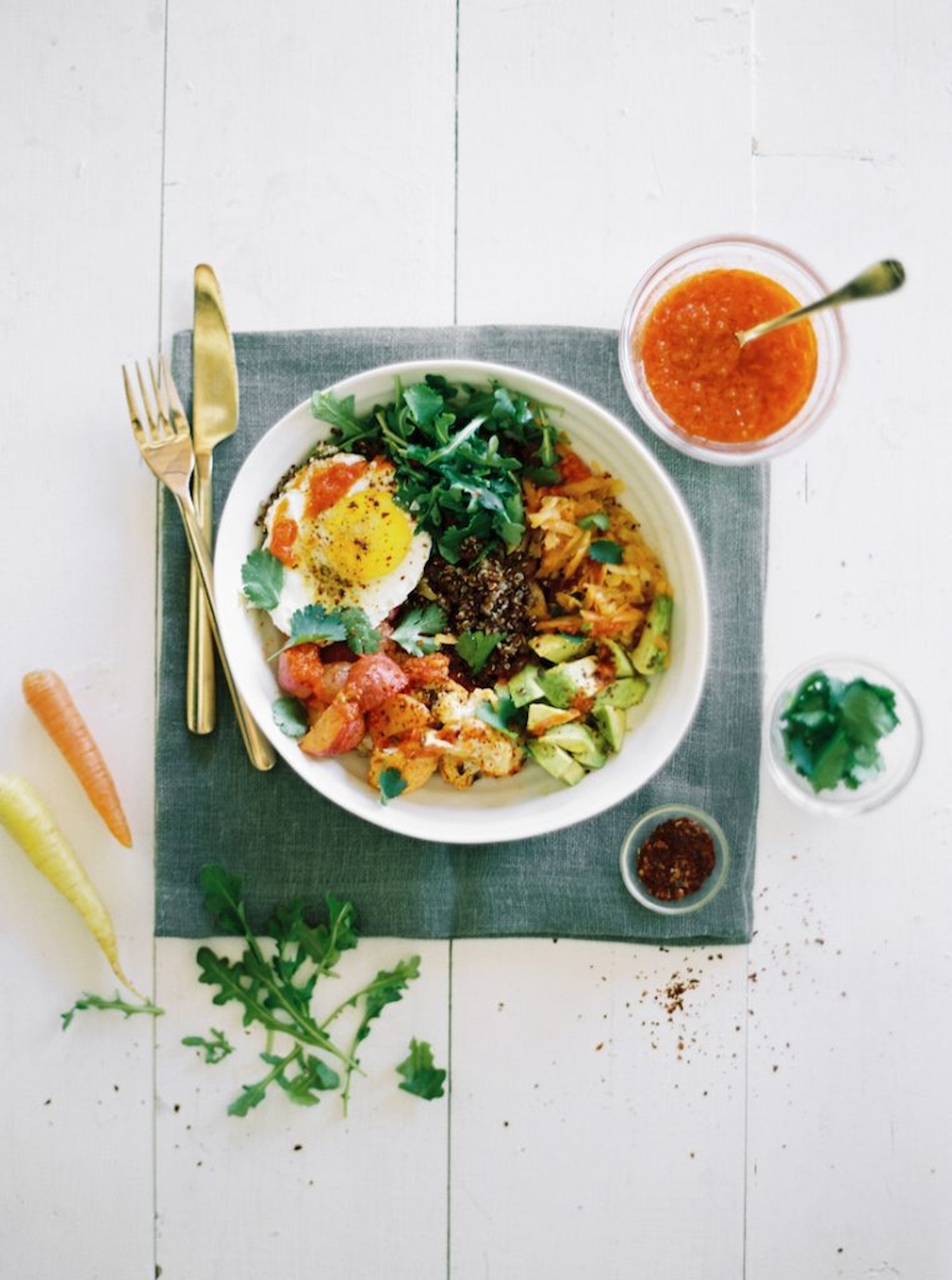 quinoa bowl with harissa roasted veggies, avocado, and fried egg