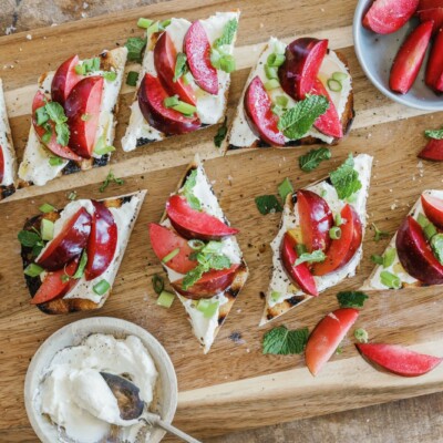 ricotta and plum bruschetta on serving board