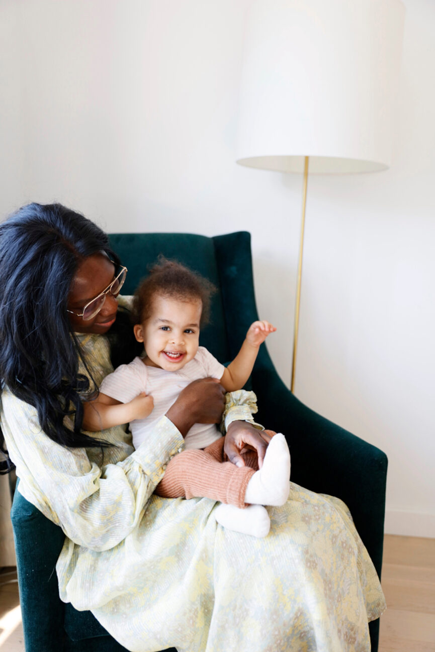 Woman embracing daughter.