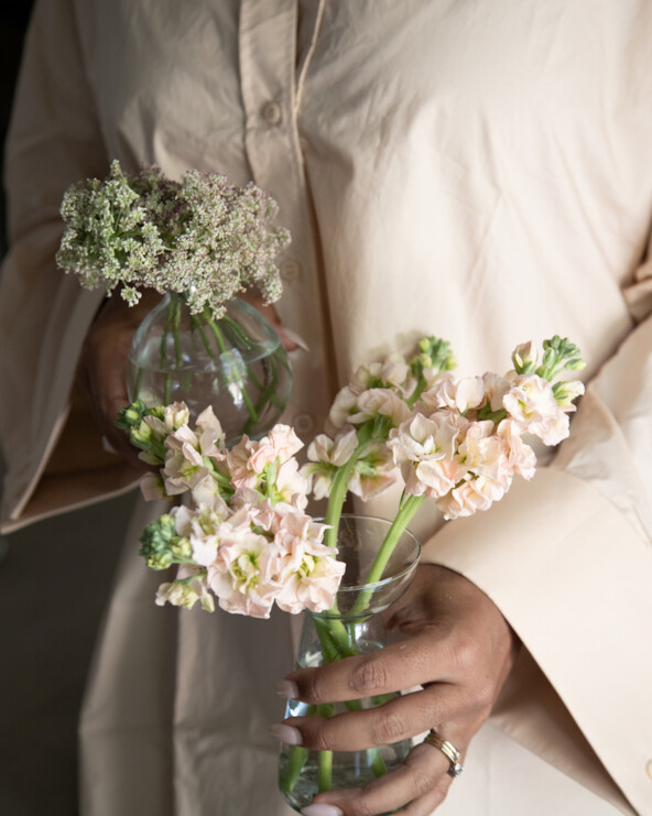 Woman holding flowers.