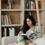 woman reading on couch