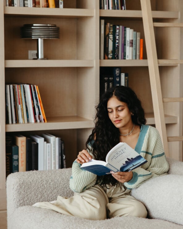 woman reading on couch